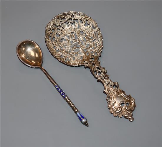 An early 20th century Russian 84 zolotnik and cloisonne enamelled spoon and a Dutch pierced and chased white metal spoon.